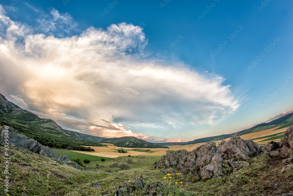 Beautiful landscape of a dramatic sky above rocky mountains, Dobrogea, Romania