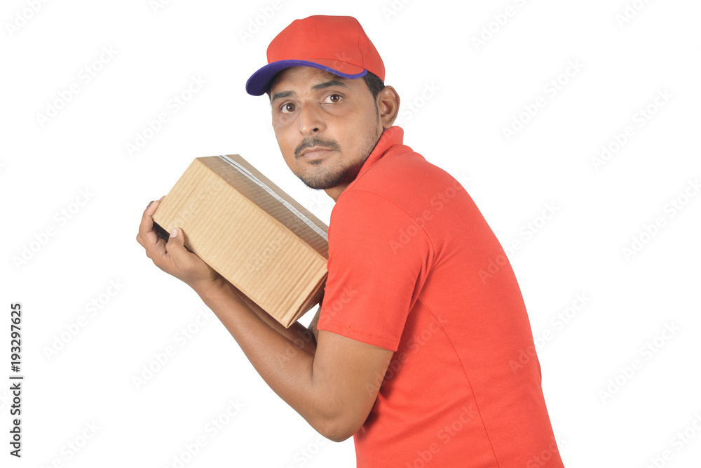 Handsome man holding carton box very tight Handsome man holding carton box very tight