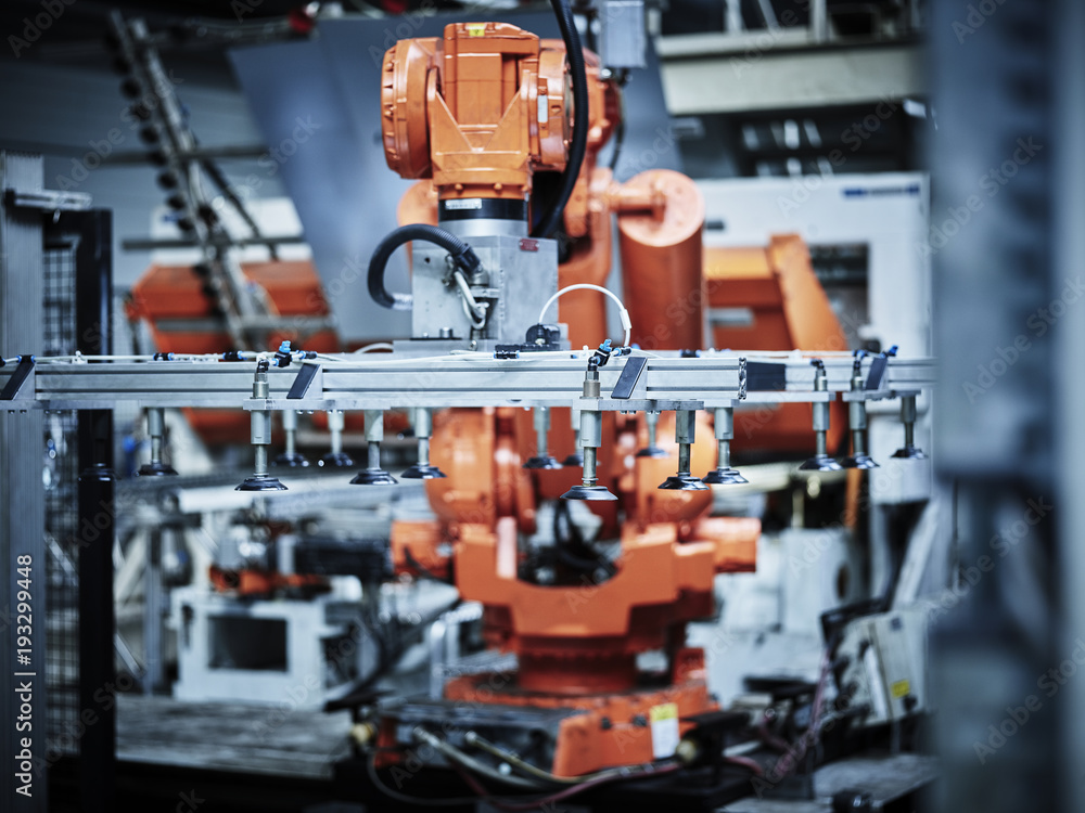 Industrial robot arm used in metalworking Industrial robot arm used in metalworking
