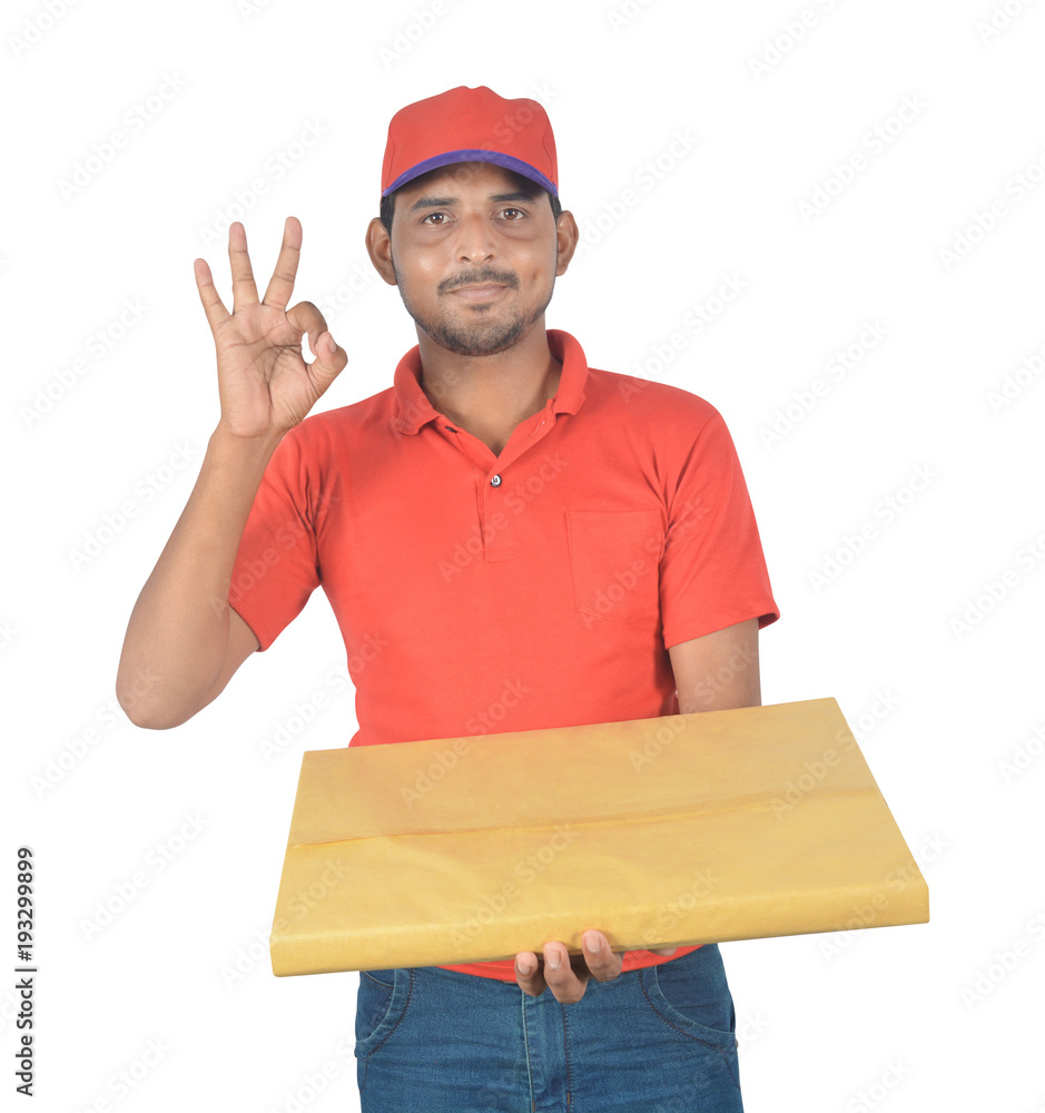 Happy delivery man holding gift pack in uniform