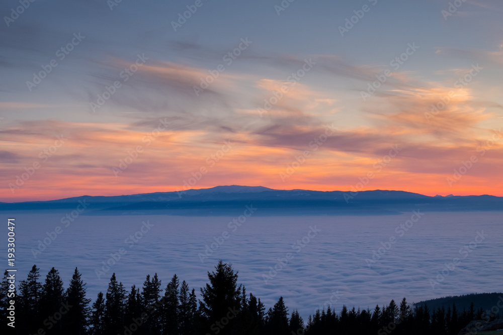 View from mountain Schoeckl over low stratus to beautiful sunset View from mountain Schoeckl over low stratus to beautiful sunset