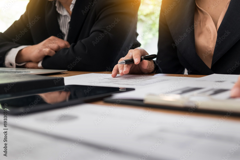Administrator business man financial inspector and secretary making report, calculating balance. Internal Revenue Service checking document. Audit concept. Administrator business man financial inspector and secretary making report, calculating balance. Internal Revenue Service checking document. Audit concept.