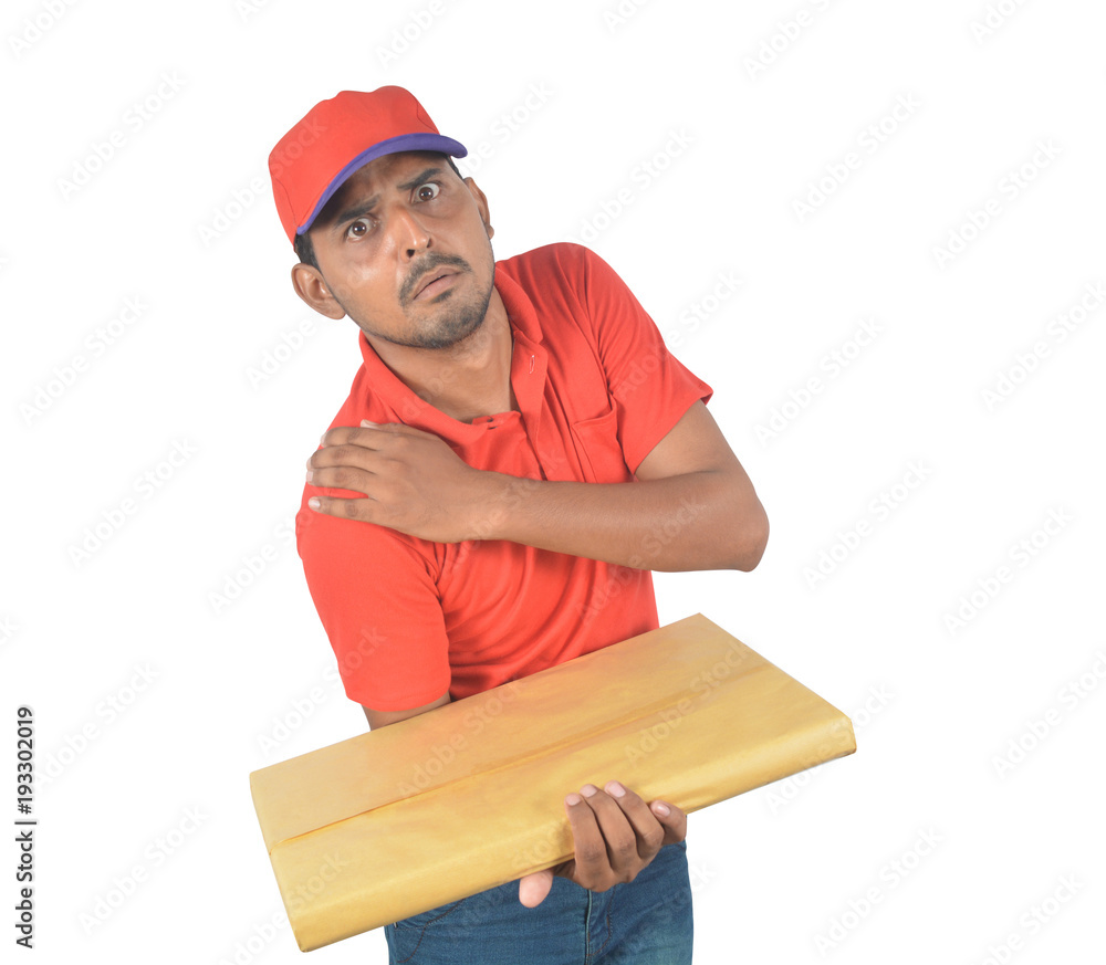Delivery man holding courier with shoulder pain in uniform Delivery man holding courier with shoulder pain in uniform