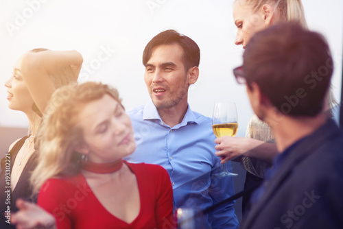 Positive young people enjoying a party © Adamov