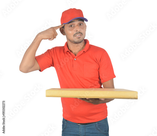 Delivery man holding courier and thinking in uniform