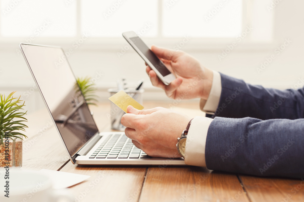 Fototapeta premium Unrecognizable man shopping online