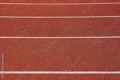 Red running track in stadium. Part of red running track 