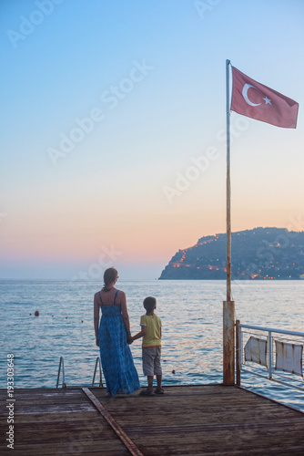 mother and son on the pier ...