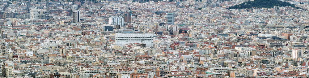 panorama aerial cityscape view of barcelona showing the dense crowded modern urban environment with housing and modern business developments