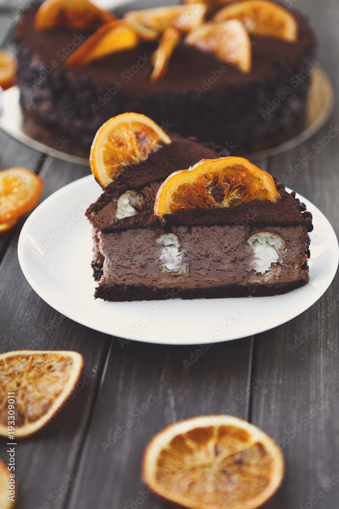 Chocolate cake with cream and profiterole Chocolate cake with cream and profiterole