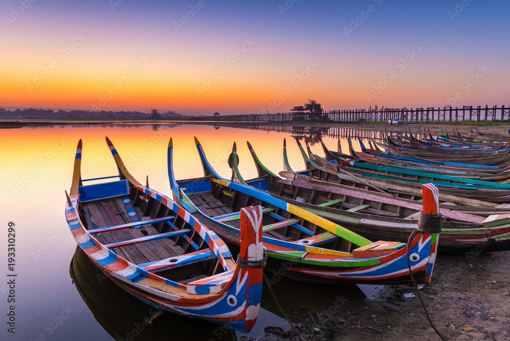 sunrise in the morning at ubein bridge with a boat