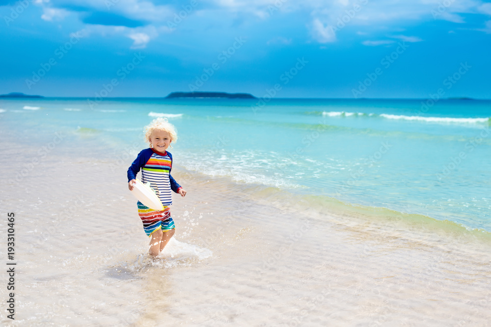 Child on tropical beach. Sea vacation with kids. Child on tropical beach. Sea vacation with kids.