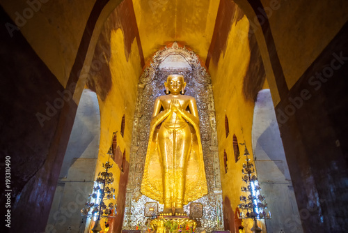 standing buddha in ananda temple, myanmar photo