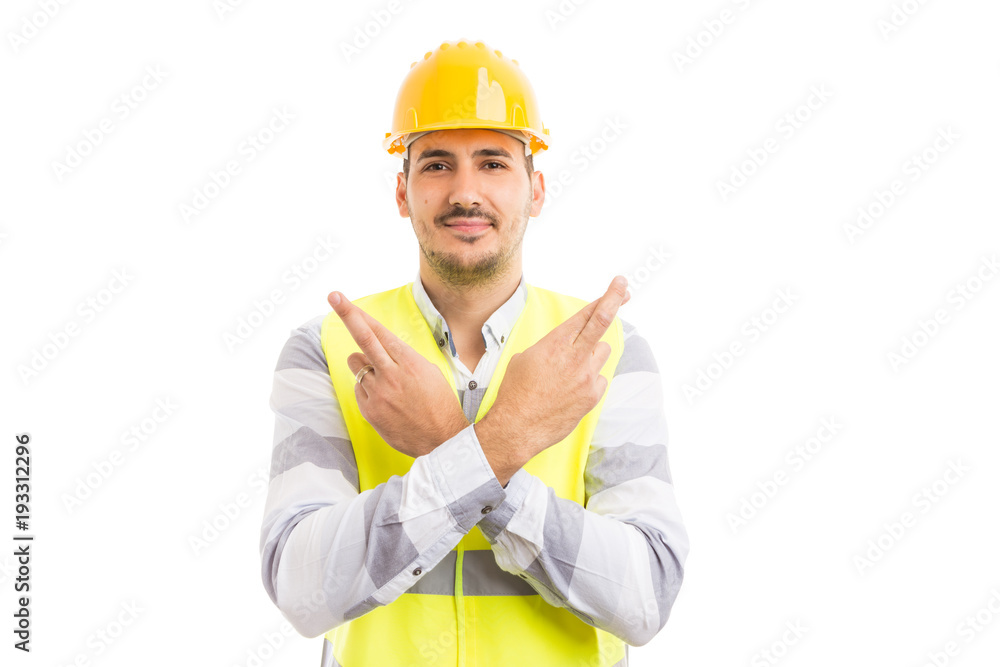 Construction builder making good luck gesture with fingers crossed. Construction builder making good luck gesture with fingers crossed.