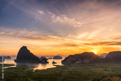 Landscape of limestone karsts in Phang nga bay at sunrise. Unseen place of 