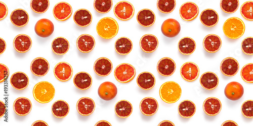 Fototapeta Naklejka Na Ścianę i Meble -  Seamless pattern of fresh oranges isolated on white background, top view, flat lay. Food texture background. Healthy food, detox, diet.