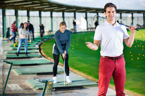 Man golf player is ready to enjoy game at golf course