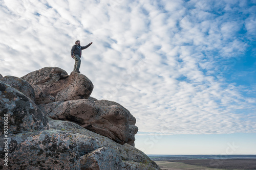 Traveler Stand on a Mountain Top photo