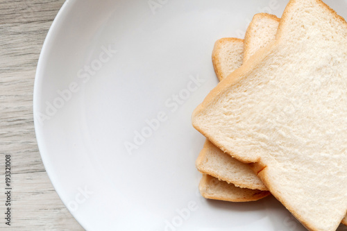Toasted slice of bread on white plate