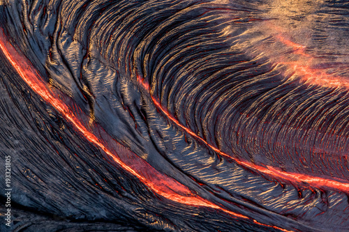 Aerial photo of lava flowing from volcano in Hawaii