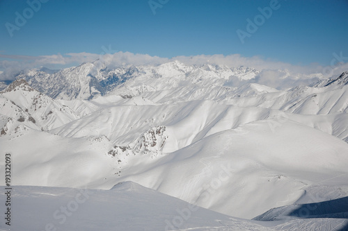 Mountain peaks covered with clear white snow