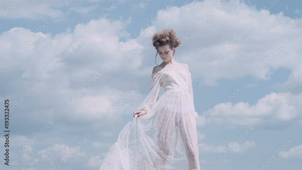 Nice girl. Blue sky. Dreaming. Girl posing. lovely girl enjoys beautifule spring day. Nice girl. Blue sky. Dreaming. Girl posing. lovely girl enjoys beautifule spring day.