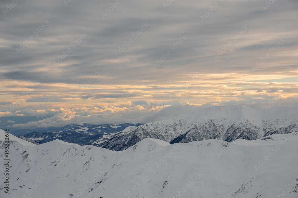 Amazing top view of cloudy sky and high mountain peaks Amazing top view of cloudy sky and high mountain peaks