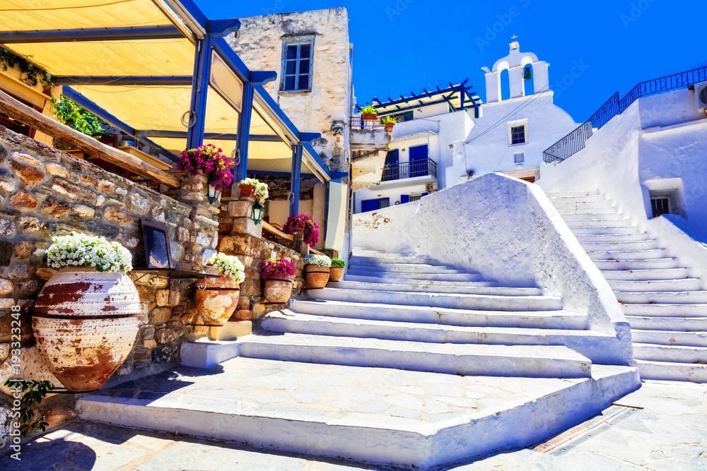 Traditional Greece - charming floral streets with tavernas, Naxos island, Cyclades - obrazy, fototapety, plakaty 