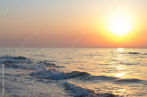 sunrise over the sea horizon  waves  splashes