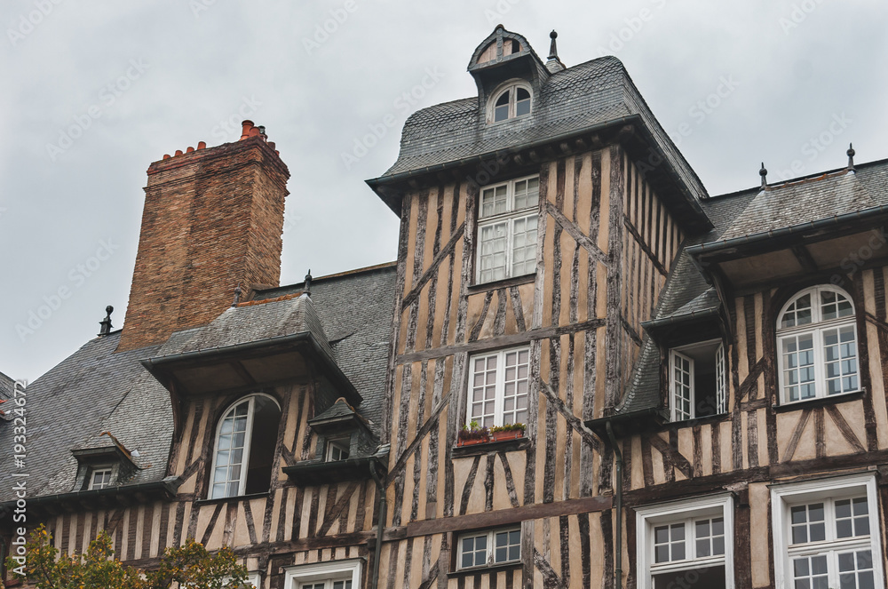 Close up of historic half-timbered houses with chimneys in old town of Rennes (Brittany, France)