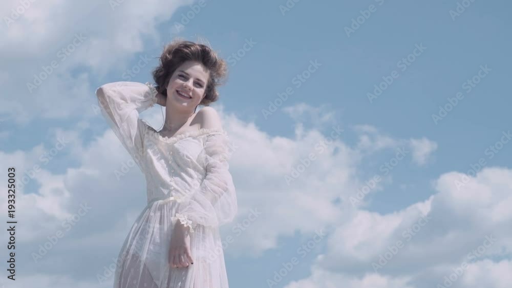 Nice girl. Blue sky. Dreaming. Girl posing. lovely girl enjoys beautifule spring day. Nice girl. Blue sky. Dreaming. Girl posing. lovely girl enjoys beautifule spring day.
