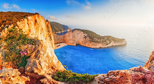 Greece. Epic sunset scenery of Zate island, full name is Zakynthos - popular summer resort and European travel destination in Greece. Picturesque Navagio beach panorama with shipwreck landmark.