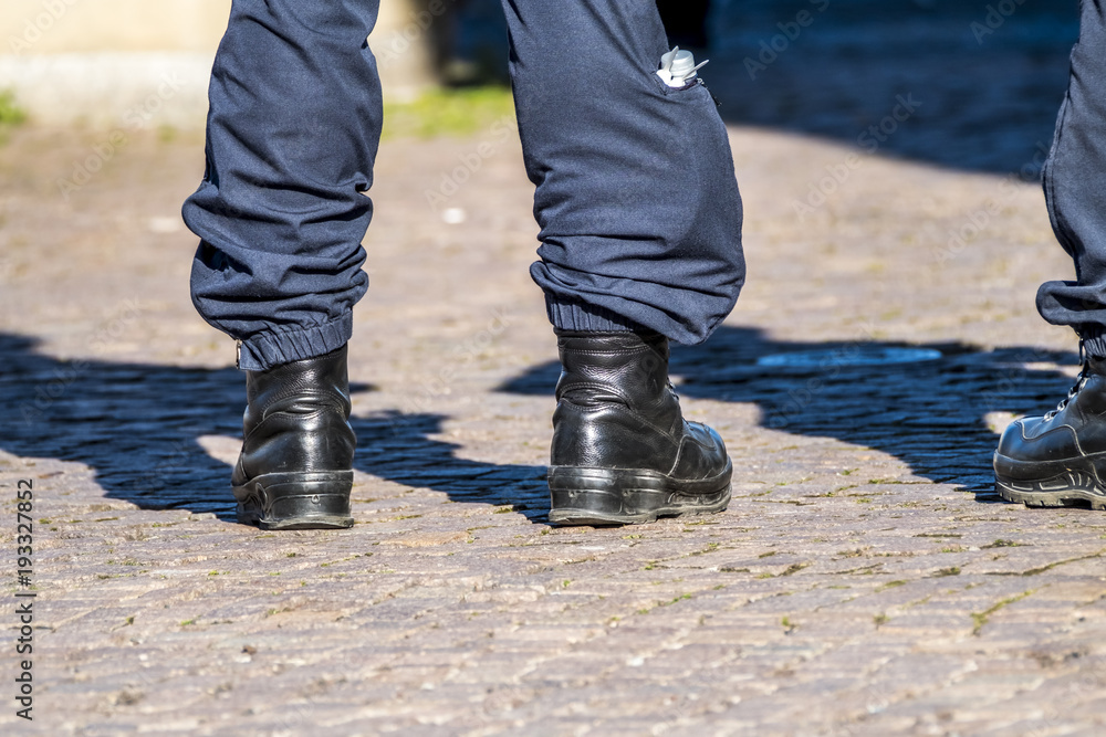 Military style black boots in the streets Military style black boots in the streets