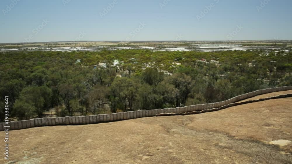 Aerial view from top of Wave Rock, Hyden, Western Australia. The natural rock formation is shaped like a high ocean wave in Hyden Wildlife Park. Wave Rock is located in Australian outback. Aerial view from top of Wave Rock, Hyden, Western Australia. The natural rock formation is shaped like a high ocean wave in Hyden Wildlife Park. Wave Rock is located in Australian outback.