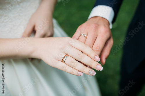 Bride in white wedding dress . Hands of the bride.