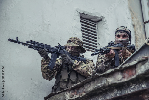 Elite squad soldiers with weapons and ammunition photo