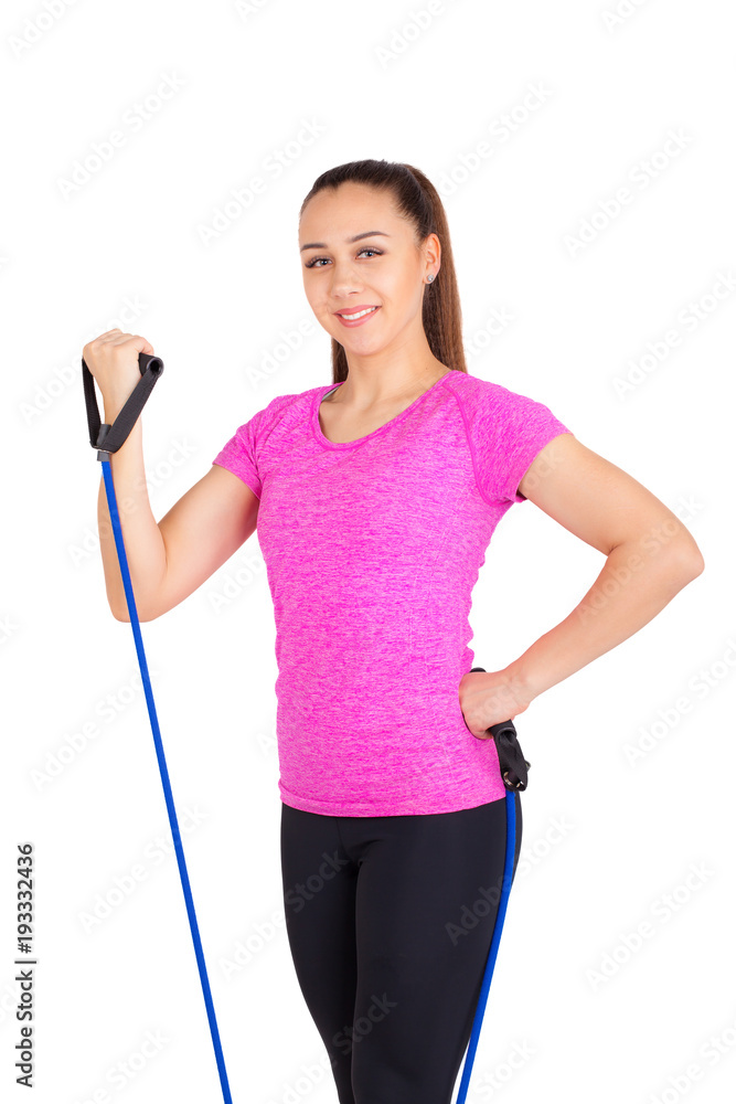 athletic girl with a gymnastic rubber band on her hands. athletic girl with a gymnastic rubber band on her hands.