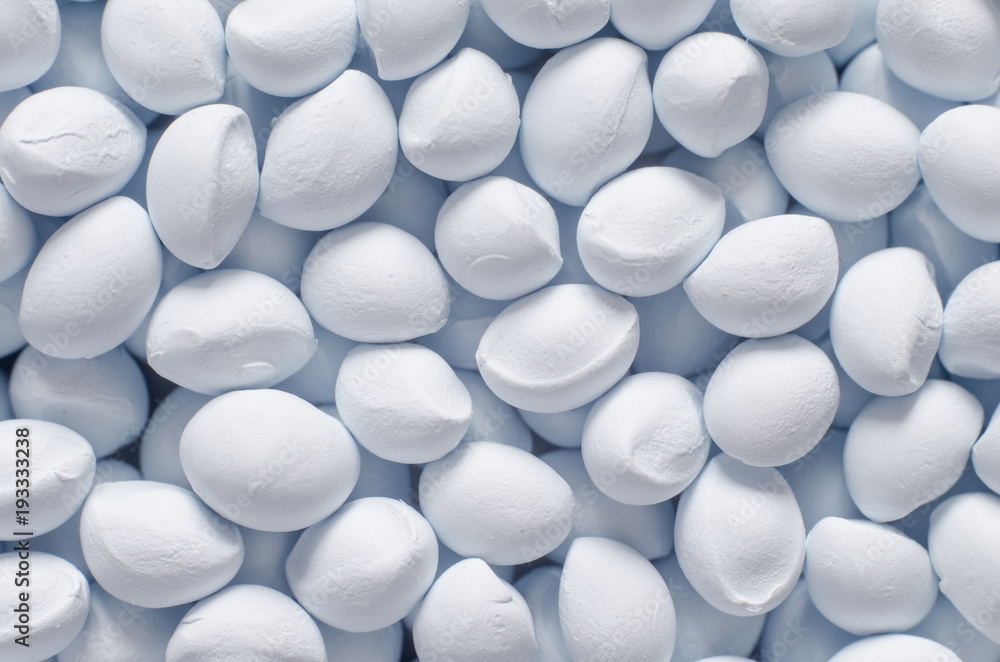 Polymer additive in granules, background texture Polymer additive in granules, background texture