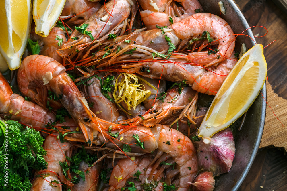 Many shrimps in a paella pan, cooking background