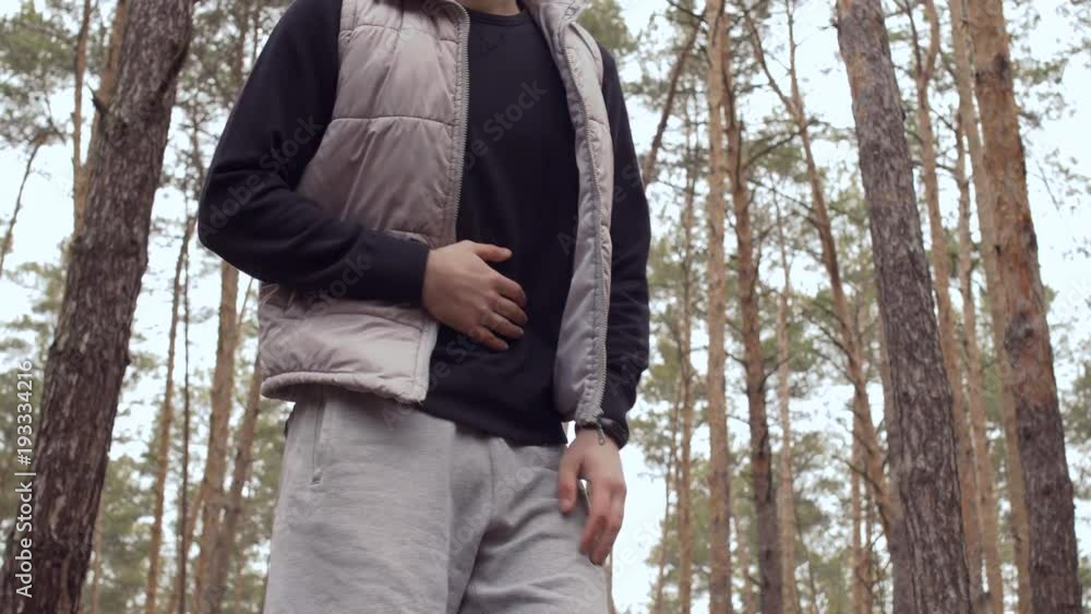 Handsome guy has a stomach pain, but he continue to run in the forest Handsome guy has a stomach pain, but he continue to run in the forest