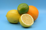 Citrus fruits on seamless blue background