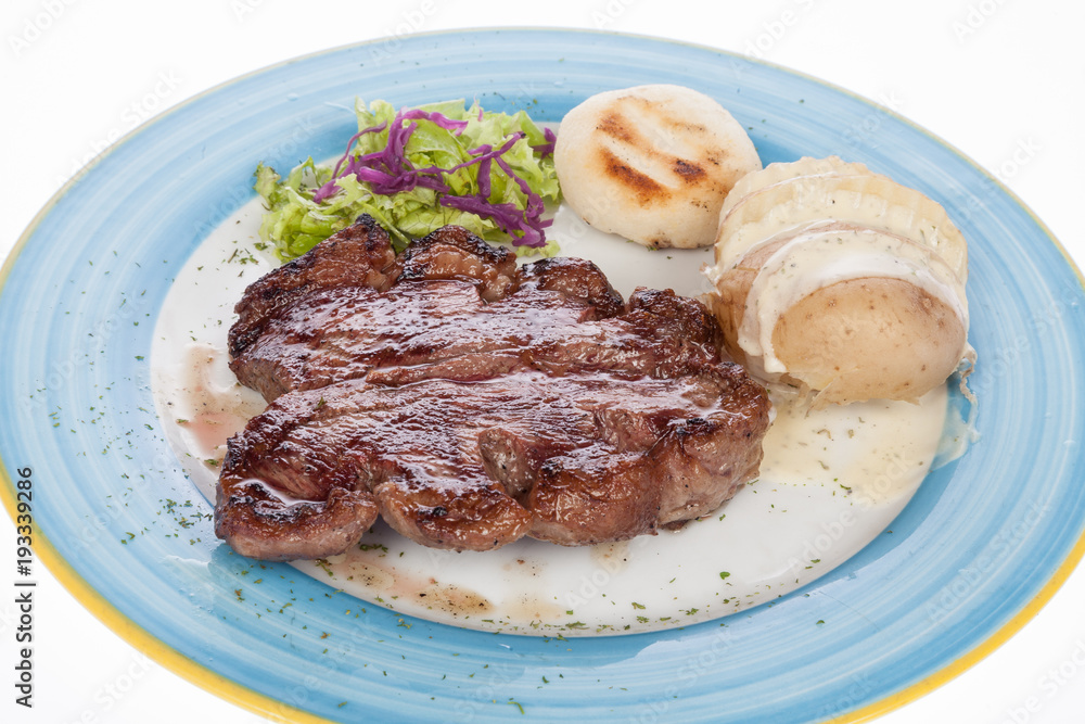 steak roast beef with steamed potatoes on white background steak roast beef with steamed potatoes on white background