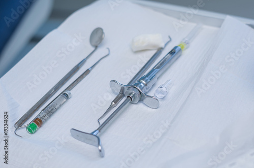 Dental instruments on the table.