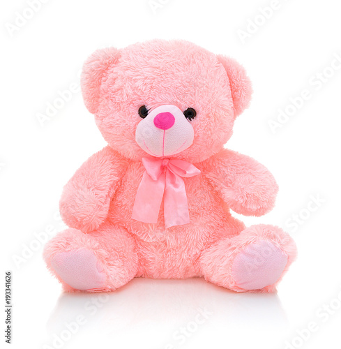 Foto Cute pink bear doll with bow isolated on white background with shadow reflection
