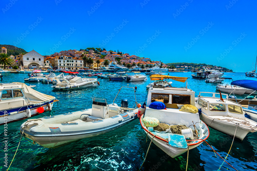 Hvar Mediterranean summer seascape. / Summer scenery in famous luxury travel destination on Adriatic Coast, Hvar town in Southern Croatia.