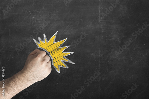 male fist against the chalkboard. Fototapete