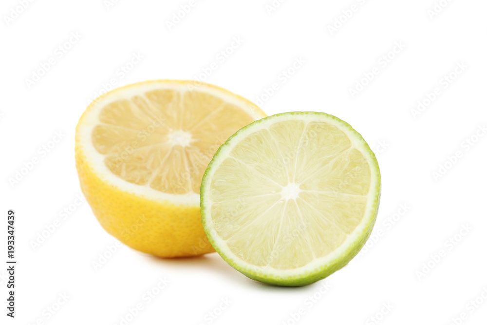 Ripe limes and lemons isolated on white Ripe limes and lemons isolated on white