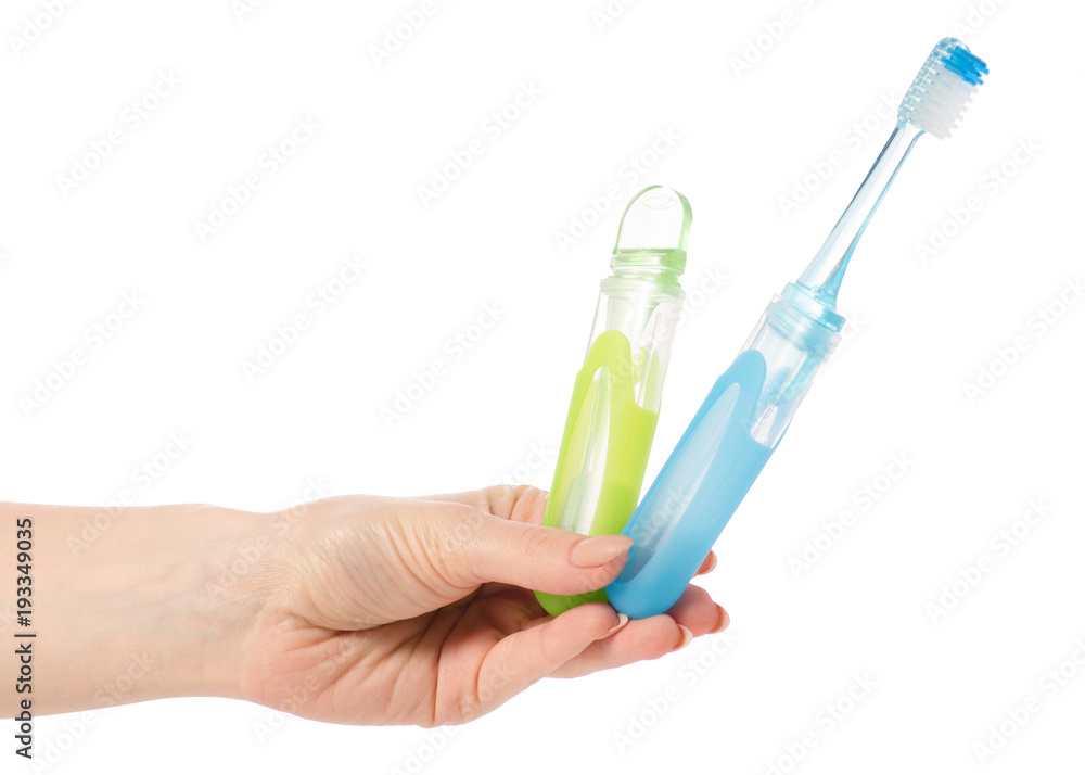 Two travel toothbrush in hand Two travel toothbrush in hand