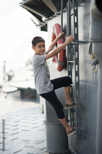Boy driving war ship military at the national museam