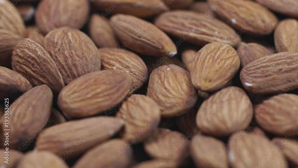 Almond closeup. Rotating nuts background Almond closeup. Rotating nuts background